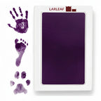 LARLEAF purple mess free ink pad and three purple ink impressions: a human handprint, a baby footprint, and a pet paw print.  Designed for newborns and pets. Capture Paw print and nose print.