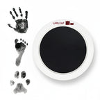 LARLEAF black round mess free ink pad featuring the brand logo. Shown next to sample prints of a hand, baby foot, and dog paw print. Circular mess-free print kit ideal for DIY Pet Memorials Goods
