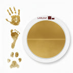 LARLEAF gold round mess free ink pad featuring the brand logo. Shown next to sample prints of a hand, baby foot, and dog paw print. Circular mess-free print kit ideal for DIY Pet Memorials Goods
