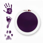 LARLEAF purple round mess free ink pad featuring the brand logo. Shown next to sample prints of a hand, baby foot, and dog paw print. Circular mess-free print kit ideal for DIY Pet Memorials Goods
