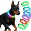Black Doberman wearing Larleaf rainbow LED dog collar for night safety. High visibility glowing collar available in multiple colors (Green, Blue, Red, Pink) for dark evening walks.