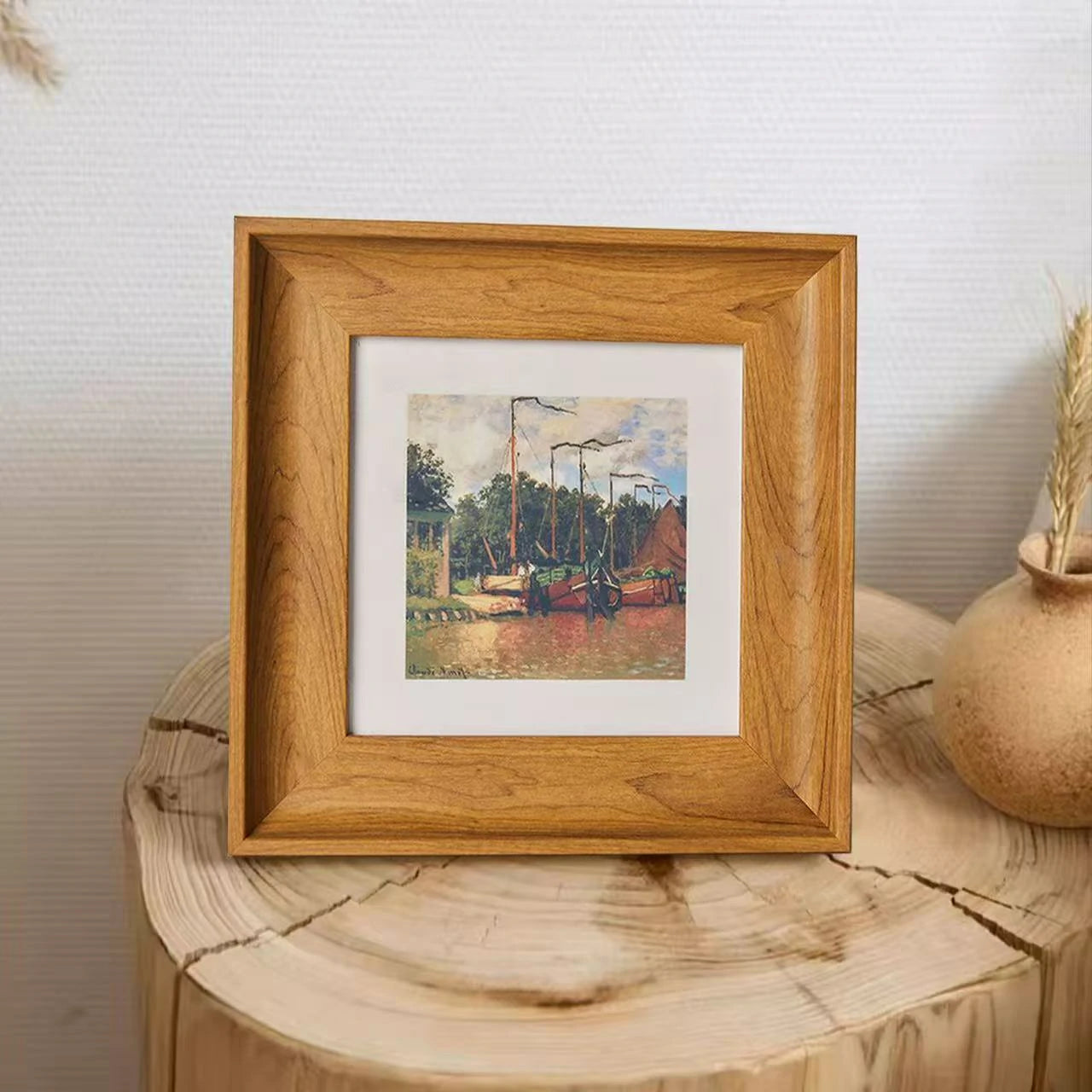 A warm and inviting display of a wooden memorial frame. Placed on natural wood, this frame is designed to hold a cherished pet's nose print. The light wood grain offers a gentle way to remember a passed dog or cat. High-quality decor for pet lovers.