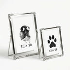Elegant silver keepsake frames with filigree corners. Perfectly frames a black ink dog nose print and a matching paw print. These delicate metal frames add a touch of vintage charm to any home decor while honoring a beloved furry friend.