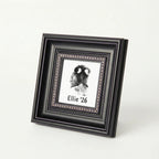 Sympathy gift for grieving dog owners: A custom nose print memorial in an ornate black frame. Features a distinct beaded border and personalized details. This touching bereavement keepsake preserves a pet's actual nose impression forever in style.
