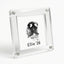 A clear acrylic magnetic frame holding a customized black dog nose print card reading "Ellie '26", attached to a stainless steel refrigerator door. Perfect as a pet memorial keepsake.