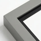 Extreme close-up detail of modern grey pet memorial shadow box frame corner. Highlights the smooth matte finish, precise mitered joinery, and contrasting black inner matting that adds depth. Demonstrates premium quality construction for a lasting tribute