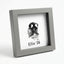 Modern grey pet memorial shadow box frame featuring a detailed dog nose print impression (snout print). Shows personalized custom text example 'Ellie '26' below the ink print. Angled view of deep frame suitable for shelf or tabletop display. A unique, minimalist sympathy gift for pet loss remembrance