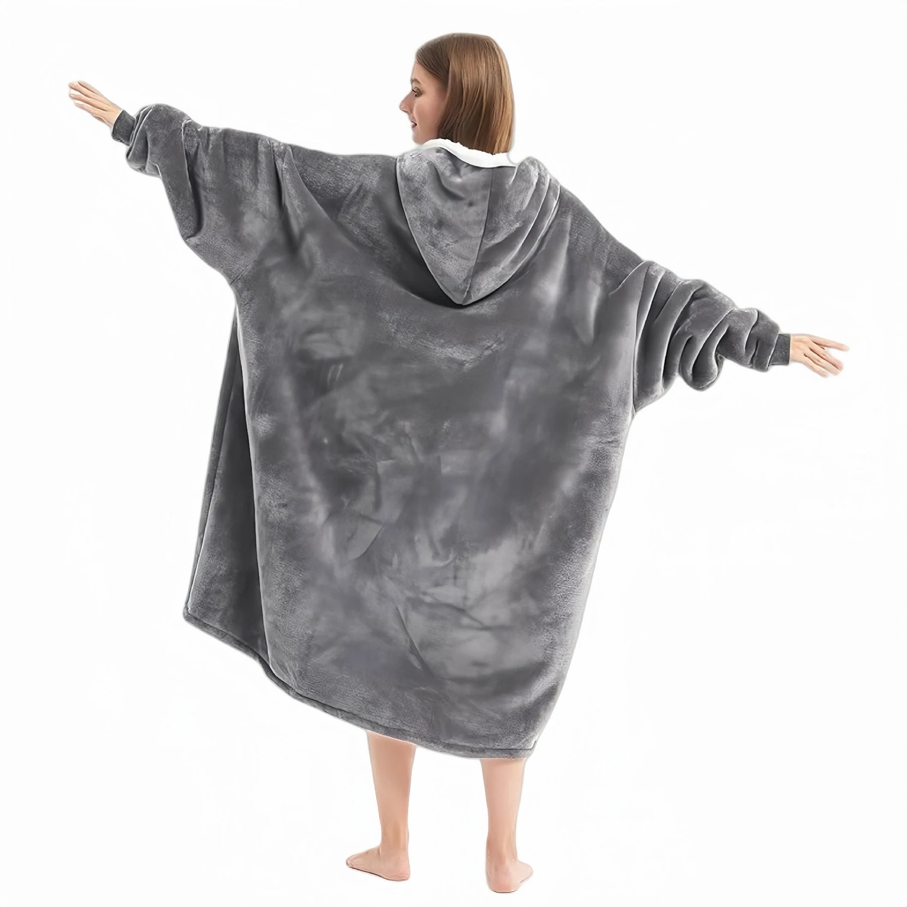 Back view of a woman wearing the Larleaf grey kangaroo wearable blanket with arms outstretched. Displays the oversized, loose fit and the soft fleece fabric texture, designed for maximum comfort and warmth at home.
