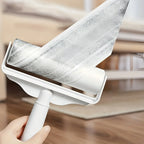 Close-up of Larleaf sticky roller sheet being peeled off. Features easy-to-tear diagonal cut design that removes pet hair and dust efficiently without waste.