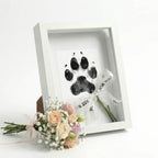 DIY pet paw print impression kit with solid wood shadow box frame and designated space for a memorial photo. This non-toxic clay mold set creates a lasting 3D tribute of your dog or cat's paw, serving as a touching sympathy gift for pet loss and remembrance